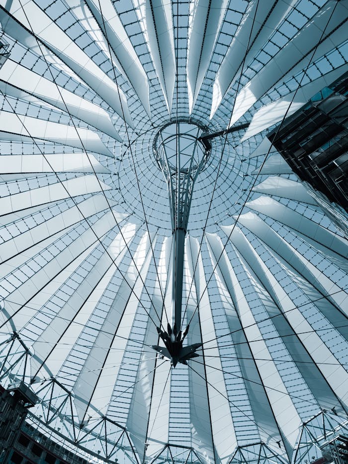 A striking view of the modern architectural structure in Berlin, showcasing geometric lines and steel framework.